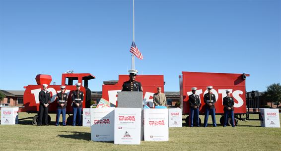 Gunnery Sgt. Jimmie Smith, coordinator, Toys for Tots, addresses the media as he officially kicks off the annual Toys for Tots campaign aboard Marine Corps Logistics Base Albany, Sept. 30.  