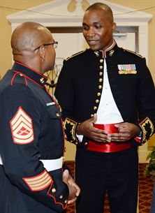 Lieutenant Col. Nathaniel K. Robinson, right, president of the mess, goes over the final details of the mess night with Gunnery Sgt. David Washington, vice president of the mess, at the Town and Country Grand Ballroom aboard Marine Corps Logistics Base Albany, recently.
