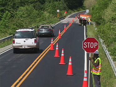 Photo of construction crews on road