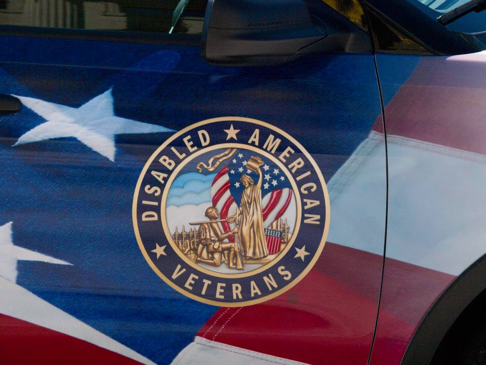 Phot of a flag displaying a logo for Disabled American Veterans