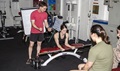 Marine Sgt. James Vincent, explosive ordnance disposal technician, explains the proper form for forearm curls as Marine Lance Cpl. Ashley Vallera, demonstrates the exercise. Muscle pain a day or so after exercise, known as delayed onset muscle soreness, is common among athletes. (U.S. Marine Corps photo by Cpl. Kyle N. Runnels)