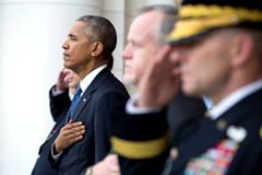 '@[424207551102424:274:President Obama] listens as Robert Swan, National Commander, Polish Legion of American Veterans, leads the Pledge of Allegiance during a Veterans Day ceremony at the Memorial Amphitheater at Arlington National Cemetery in Arlington, Virginia, Nov. 11, 2016. (Official White House Photo by Pete Souza)'