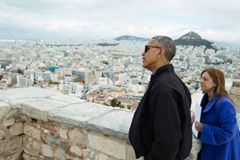 'President Barack Obama looks at the view from Belvedere Tower during a tour of the Acropolis in Athens, Greece, Nov. 16, 2016. Dr. Eleni Banou, Director, Ephorate of Antiquities for Athens, Ministry of Culture, leads the tour. (Official White House Photo by Pete Souza)'
