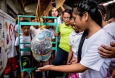 'Students demonstrate proper hand washing steps during a Global Handwashing Day celebration in  October 15 on the island of Leyte – an area hit hard by Typhoon Haiyan in 2013. 

Thyjiacinth Ylla Mavourneen De Ocampo/ @[220779007947516:274:Philippine Red Cross]'