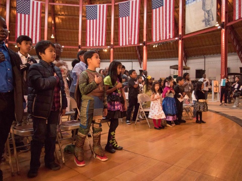 Children in costume taking oath of allegiance