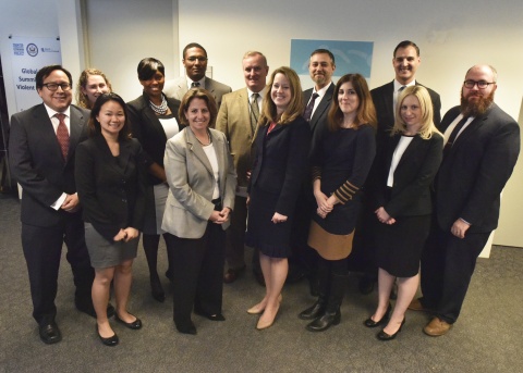 Lisa Monaco poses for a photo with staff from the Office for Community Partnerships. 