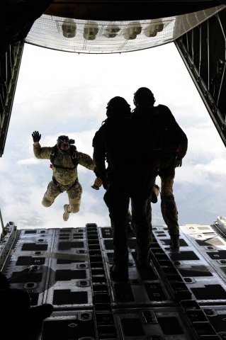 Rescuemen Jump Out of Plane (USCG)