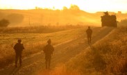 Photo: U.S. Army Europe soldiers of the 2nd Cavalry Regiment, patrol a road at the Grafenwoehr Training Area at sunrise during Saber Junction 2012, Oct. 13. U.S. Army Europe's exercise Saber Junction trains U.S. personnel and more than 1,800 multinational partners from 18 European nations ensuring multinational interoperability and an agile, ready coalition force.