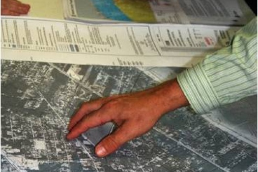 People examining flood maps