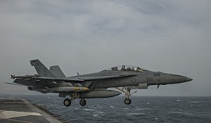 An F/A-18F Super Hornet from the Fighting Redcocks of Strike Fighter Squadron (VFA) 22 launches from the flight deck of aircraft carrier USS Carl Vinson (CVN 70) as the ship conducts flight operations. 