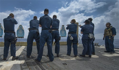 MEDITERRANEAN SEA - Sailors assigned to the guided-missile destroyer USS Gravely (DDG 107) conduct weapons qualifications on the flight deck. Gravely, homeported in Norfolk, Va., is
on a scheduled deployment supporting maritime security operations and theater security cooperation efforts in the 6th Fleet area of responsibility. 