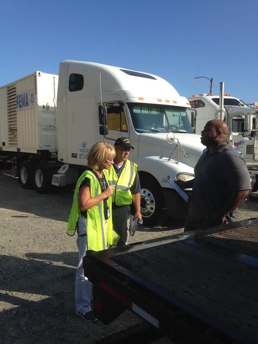 FEMA Region III’s Marlon Owens (far right) coordinates with logistics staff to organize and place trucks with food, water, and blankets at the staging area at Fort A.P. Hill, Virginia in anticipation of Hurricane Matthew. Those resources were then moved to the states that needed them most, including North and South Carolina, Georgia, and Florida.