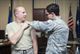 Brig. Gen. Carl Schaefer (left), 412th Test Wing commander, receives his flu shot from Staff Sgt. Jeffrey Rodriguez, 412th Medical Operations Squadron. (U.S. Air Force photo by Ethan Wagner)