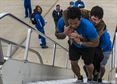 Tech. Sgt. Chris Ferrell, 11th Civil Engineer Squadron&#39;s
Explosive Ordnance Disposal flight, carries 1st Lt. Nathan Nelson, up a
flight of stairs so they can tour an 89th Airlift Wing C-32A at Joint Base
Andrews, Md. Nelson was hit with a 107mm rocket in Afghanistan and is
paralyzed. Ferrell was also wounded while disarming a road-side bomb in
Afghanistan and will be pinned with a Purple Heart Medal during an NFL
half-time show by Maj. Gen. Darryl Burke, Air Force District of Washington
commander, during the Redskins vs. Cowboys game, Dec. 7, 2015. (U.S. Air
Force photo by Senior Master Sgt. Kevin Wallace/RELEASED)
