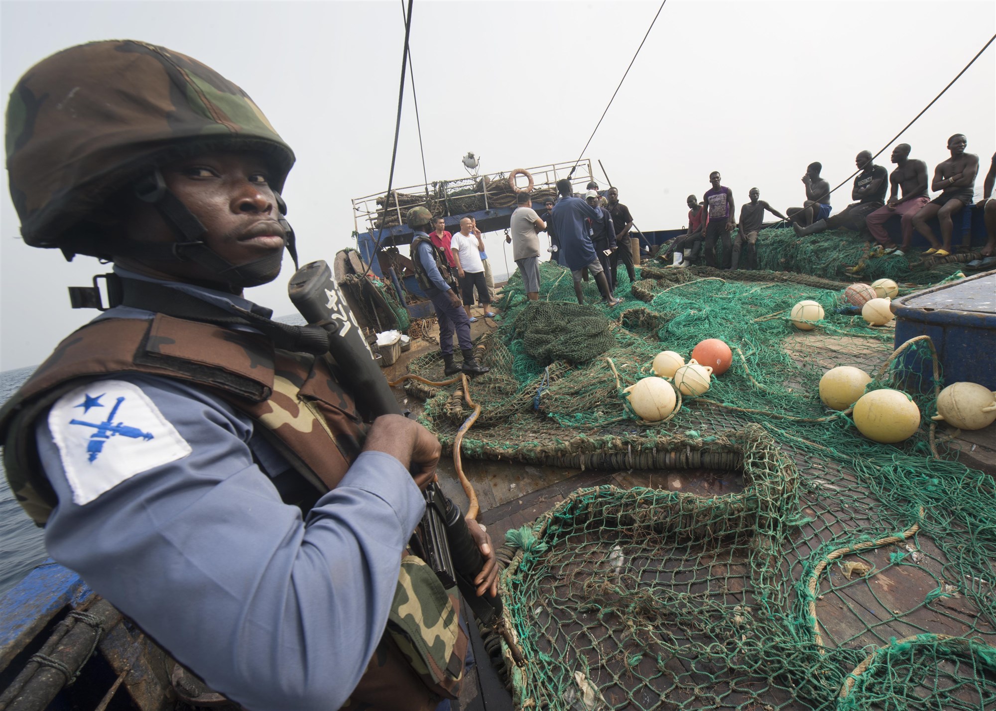 (Feb. 6, 2016) - A member of the Ghanaian Navy stands aboard a fishing vessel during a combined joint boarding operation Feb. 6, 2016. The Military Sealift Command expeditionary fast transport vessel USNS Spearhead (T-EPF 1) is on a scheduled deployment to the U.S. 6th Fleet area of operations to support the international collaborative capacity-building program Africa Partnership Station. 