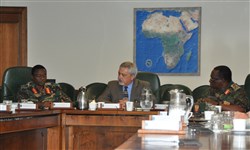 Ambassador Phillip Carter, III, deputy to the commander for civil-military engagement, addresses Maj. Gen. Salim Mustafa Kijuu, land force commander of the Tanzanian People's Defence Force, and Brig. Gen Zoma Mathik Kongo, director of operations for the TPDF during a Command Sponsored Visit coordinated by U.S. Army Africa July 8, 2015.