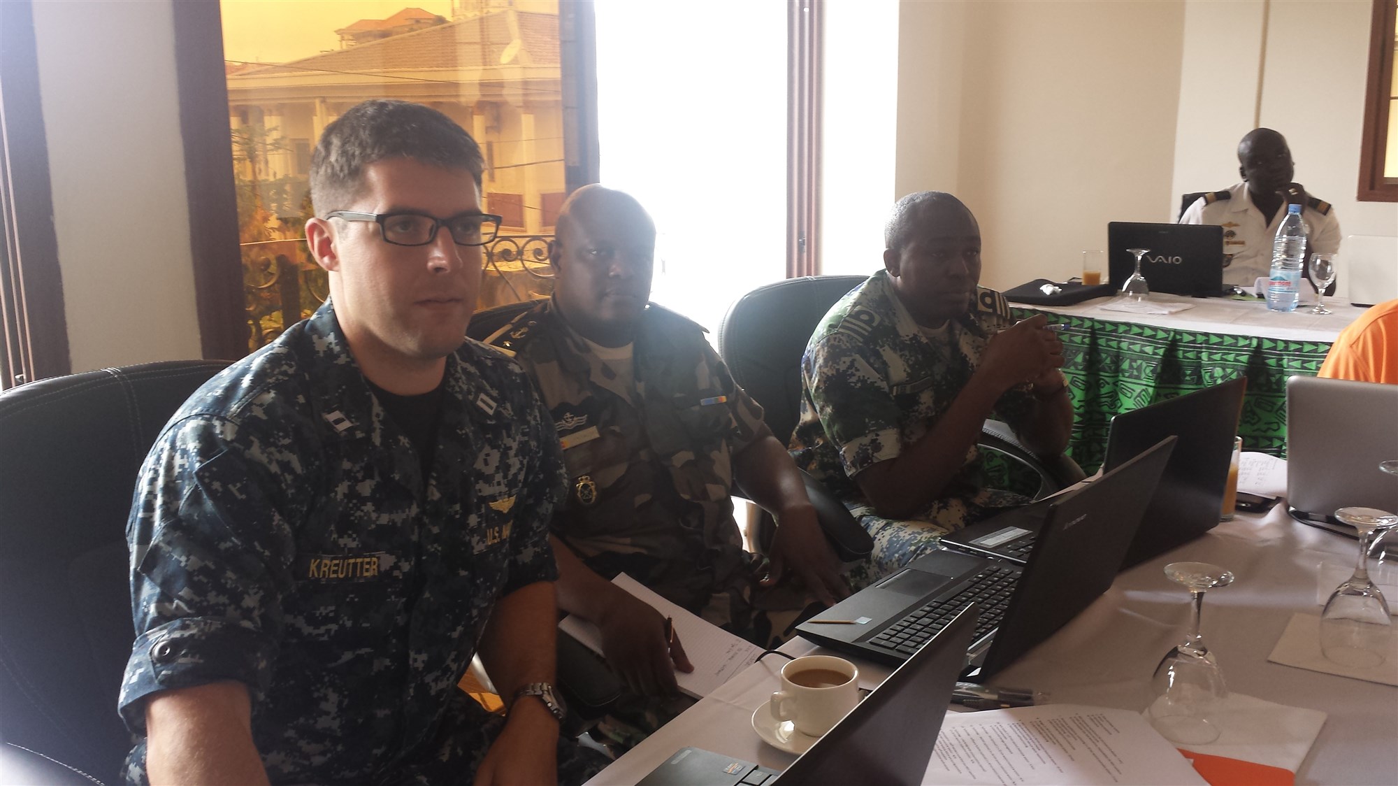 U.S. Navy Lt. Jason Kreutter, U.S. Naval Forces Europe-Africa/U.S. 6th Fleet (CNE-CNA/C6F) Maritime Domain Awareness (MDA) Officer, and officers from Gulf of Guinea nations work together as part of a Maritime Operations Center (MOC) Curriculum Finalization Workshop in Yaounde, Cameroon, July 16, 2015. The workshop, sponsored by CNE-CNA/C6F, is being held to further develop MOC standards and gain sufficient input from Gulf of Guinea partner nations in order to finalize the curriculum for a MOC/MDA training course that will be used throughout the region for future training. (Photo courtesy of the Interregional Coordination Center)