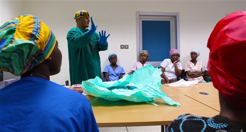 U.S. Army Staff Sgt. Adrian Elisondo, an operating room technician with the 30th Medical Brigade, demonstrates procedures prior to surgery during a class with medical students at the 37th Military Hospital in Accra, Ghana on Aug. 3, 2015 during Medical Readiness Training Exercise (MEDRETE) 15-2. MEDRETE 15-2 is part of a series of exercises designed to build the medical capacity of partner nation militaries in Africa.  (U.S. Army Africa photo by Capt. Charles An)
