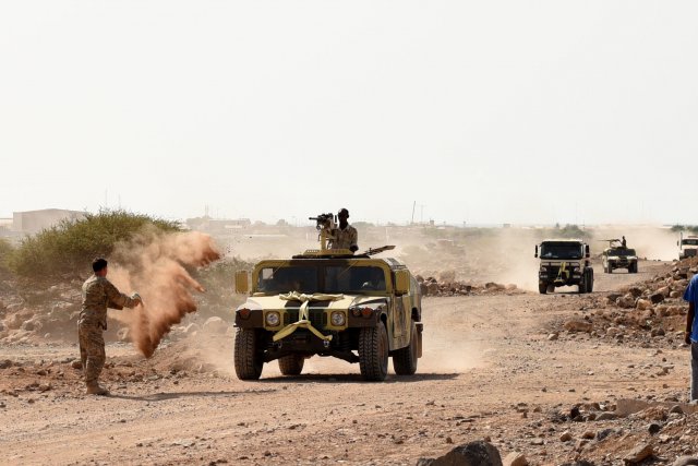 U.S. Army Sgt. Robert Shelton, U.S. Army Regionally Aligned Forces instructor, throws dirt at a Humvee to simulate a roadside detonation causing immobility during area Logistics Training final with Djibouti Armed Forces (FAD) soldiers, May 16, 2016, at Camp Cheik Osman, Djibouti.  The FAD soldiers tested combat skill they learned throughout the five month course demonstrating their reactions to various mock simulations from convoying through a road block, identifying mock roadside bombs, medical care, and vehicle recovery.  