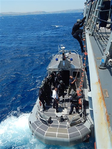 140614-N-GS541-378: MEDITERRANEAN SEA (June 14, 2014) – A visit, board, search and seizure team from the Tunisian Navy Combattante III La Galite Patrol Craft debarks the guided-missile destroyer USS James E. Williams (DDG 95) after a successful afternoon of boarding exercises between the U.S. and Tunisian Navies. The exercises taking place were part of an effort to enhance the skills of both teams and strengthen maritime security in the Mediterranean region. (U.S. Navy photo by Ensign Michael Scarborough/Released)