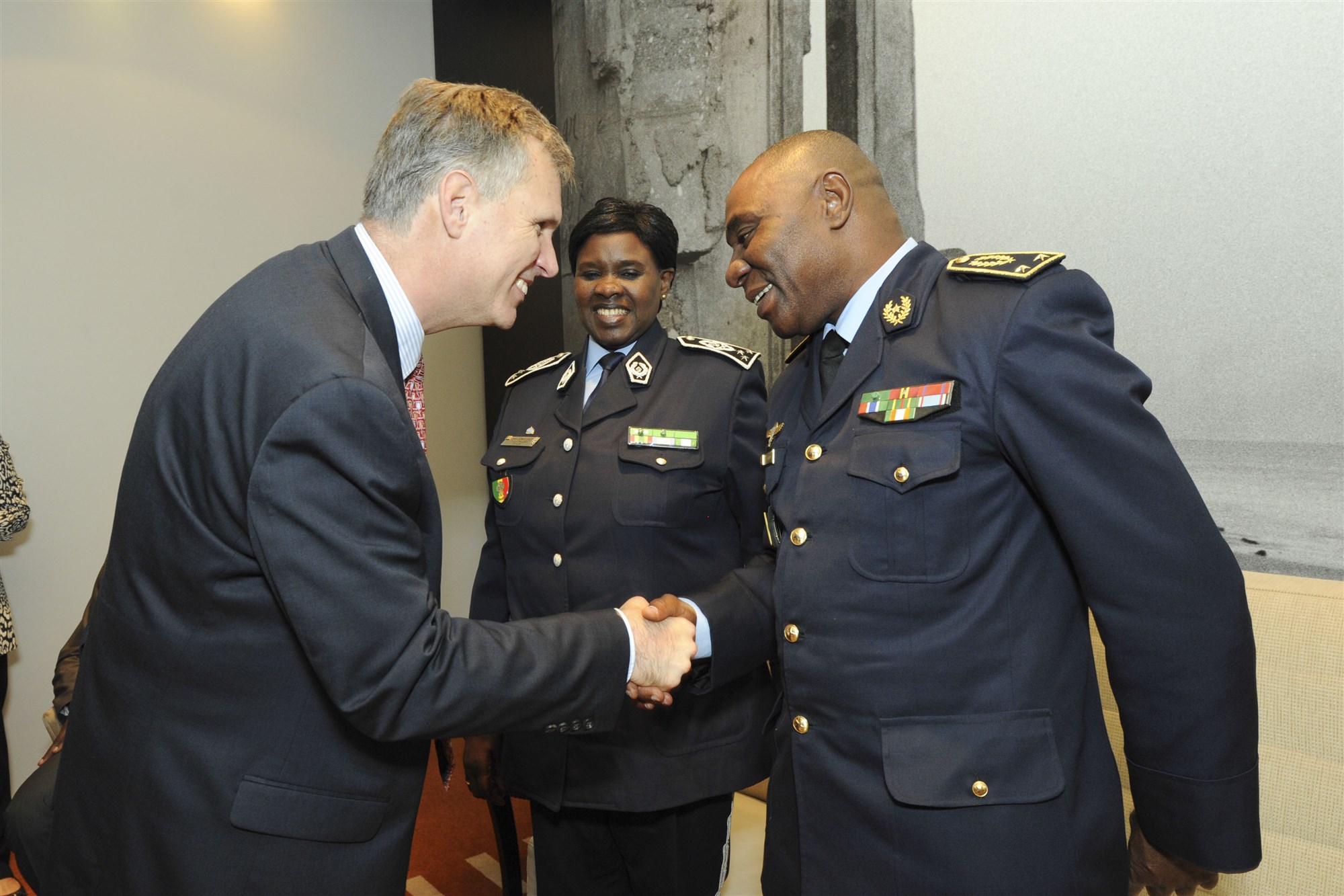 U.S. Africa Command Chief of Humanitarian and Health Activities, Michael Hryshchyshyn (left), greets the Commander of the Senegalese National Brigade of Firefighters, Brig. Gen. Papa Samba KAMARA (right), and Senegalese Inspector General of the National Police Anna Semou FAYE (center) prior to the opening ceremony of the Republic of Senegal Disaster Preparedness and Response Exercise in Dakar, Senegal, 2 June. The event represented a successful collaboration among international and interagency organizations, with the Government of Senegal hosting an event sponsored by U.S. Africa Command and executed by the Center for Disaster and Humanitarian Assistance Medicine. (U.S. Africa Command photo by Petty Officer First Class D. Keith Simmons)