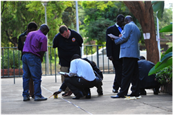 Members of the U.S. Federal Bureau of Investigation work with a group of agents with the Malawi National Intelligence Bureau the basics of crime scene processing during Exercise Epic Guardian 2013 outside the U.S. Embassy Public Affairs Section in Lilongwe, Malawi, on May 7. (U.S. Air Force photo by Master Sgt. Larry W. Carpenter Jr.)