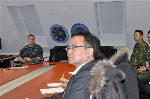 A team of Japanese Public Affairs Officers (PAOs) gets a tour of the command's public affairs office during a visit to U.S. Africa Command's headquarters in Stuttgart, Germany, Jan. 23, 2015.  