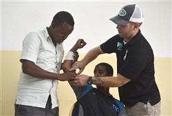 U.S. Army Staff Sgt. Joshua Domalski, Civil Affairs Battalion specialist and medic, right, demonstrates first aid procedures for community health workers in Obock, Djibouti, Oct. 17, 2015. The U.S. Army Civil Affairs Bn, assigned to Combined Joint Task Force-Horn of Africa, held a community health worker course, during which instructors taught basic preventative medicine measures, first aid, oral hygiene care, and the health hazards of female genital mutilation.