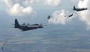 Two U.S. Air Force MC-130J Commando IIs perform Maritime Craft Aerial Delivery System drops over the Little Belt Strait in Denmark Sept. 27, 2016. After the Rigid inflatable Boats were deployed, U.S. Navy Special Warfare Combatant-Craft crewmen followed to set up the equipment. Finally, a third aircraft off loaded U.S. Air Force and Danish air commandos at the drop zone. (U.S. Air Force photo by Senior Airman Justine Rho)