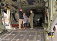 A U.S. Air Force loadmaster, right, from the 67th Special Operations Squadron, talks to families of amputees about the 352nd Special Operations Wing mission at the Steel Bones event Oct. 24, 2016, on RAF Mildenhall, England. Steel Bones is a local British organization similar to the Wounded Warrior Program, specifically aimed at providing support to amputees and their families. More than 60 people visited the base to attend the event which was supported by the 100th Civil Engineer Squadron, 100th Security Forces Squadron, 100th Air Refueling Wing and 352nd Special Operations Wing. Local Paralympian swimmer, Harriet Lee, also attended the event and brought her silver medal won at the Rio Paralympics earlier this year. (U.S. Air Force photo by Karen Abeyasekere)