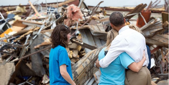 Photo of President Obama and disaster survivors visiting the site of a former school
