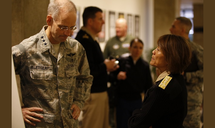 Navy Vice Adm. Raquel Bono, director, Defense Health Agency (right), speaks with Lt. Gen. Mark Ediger, the Air Force Surgeon General. Bono told Ediger and about 400 attendees of the Air Force Medical Service’s Senior Leadership Workshop that supporting the services is one of her top priorities. (MHS photo)