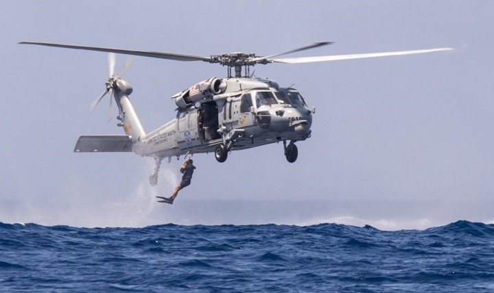 A search and rescue corpsman deploys from a MH-60S Seahawk helicopter during search and rescue swimmer training. 