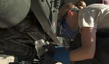 Airman Lorinda Hochstetler, 92nd Logistics Readiness Squadron refueling equipment operator, checks the quality of the fuel inside the R-11 fuel tanker trucks at the fuel equipment staging area July 25, 2016, at Fairchild Air Force Base, Wash. Vital to ensure that no contaminants make it into aircraft, fuels airmen check fuel purity regularly. (U.S. Air Force photo/ Airman 1st Class Ryan Lackey)