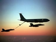 A KC-135 Stratotanker refuels an F-15 Eagle midflight. The Stratotanker was originally used to support bombers of the Strategic Air Command. The midair refueling capabilities allowed fighter missions to spend hours on the front lines, rather than a few minutes, which was usually due to the limited size of fuel tanks in the fighters. (Courtesy Photo) 