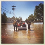 <p>USAR teams evacuating survivors from a North Carolina neighborhood in the aftermath of Hurricane Matthew</p>