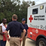 Image cover photo: FEMA Officials and Red Cross discuss situation