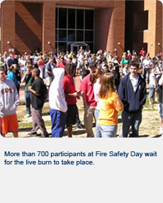 More than 700 participants at Fire Safety Day wait for the live burn to take place.