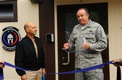 Admiral James Stavridis, Supreme Headquarters Allied Powers Europe commander, (left) looks on, as Gen. Philip M. Breedlove, Allied Air Command Ramstein commander, addresses NATO and senior leaders prior to the European Integrated Air and Missile Defense Center ribbon-cutting ceremony Sept. 26, 2012. The EIAMDC addresses increased education and training requirements driven by a new approach to missile defense and the emerging NATO territorial ballistic missile defense mission. 