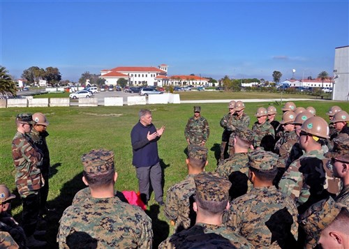 ROTA, Spain (Jan. 12, 2011) Mike Dozier, senior personnel recovery analyst for Commander, U.S. Naval Forces Europe-Africa, speaks to service members assigned to Naval Mobile Construction Battalion (NMCB) 74, about properly signaling aircraft during personnel recovery training at Naval Station Rota, Spain.  More than 800 service members assigned to Commander Task Force (CTF) 68 were trained in survival techniques in case they become isolated while on deployment in austere locations. (U.S. Navy photo by Mass Communication Specialist 1st Class Paul Cage/Released)