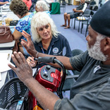 Image cover photo: FEMA assists a survivor with disabilities with application process