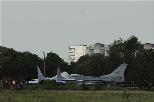 On July 30, 2011, an F-16 Fighter Aircraft from the 187th Fighter Wing, Alabama Air National Guard, taxis by a Ukrainian Mig-29 for the final time at Mirgorod Air Base, Ukraine as Safe Skies 2011 comes to an end.  Safe Skies is a military to military exchange between the US, Ukraine and Poland to protect and manage regional air space and promote air security and stability as Ukraine and Poland prepare for EUROCup 2012. (U.S. Air Force photo by SMSgt Chris Drudge)