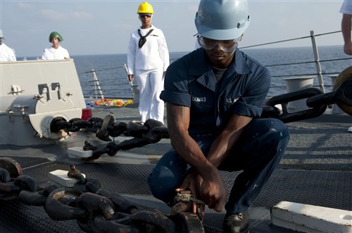 HAIFA, Israel - Seaman Collins Dumas prepares to anchor as the guided-missile destroyer USS Jason Dunham (DDG 109) enters the port of Haifa to take part in Exercise Reliant Mermaid 2012. This is the 11th iteration of Reliant Mermaid, an annual search and rescue exercise designed to increase interoperability by developing individual and collective maritime proficiencies of participating nations, as well as promoting friendship, mutual understanding and cooperation. 