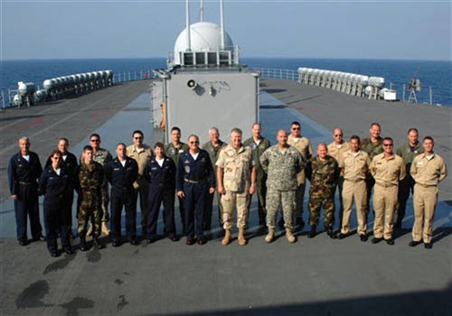 USS MOUNT WHITNEY, Eastern Mediterranean -- Reservists stand with their active duty chain of command leaders. Commander, Joint Task Force (JTF) Lebanon Navy Vice Adm. J. &#34;Boomer&#34; Stufflebeem (center front), Chief of Staff Army Col. Peri Anest (right) and Commanding Officer, USS Mount Whitney Navy Capt. Joe Kuzmick (left).  Reserve members here play a critcal role in contributing to the JTF Lebanon mission.  As current operations continue to support Department of State-led humanitarian assistance to the people of Lebanon, more reservists will continue to supplement the JTF Lebanon staff. (Department of Defense photo by Mass Communications Specialist 2nd Class(SW/AW) Rosa Larson)