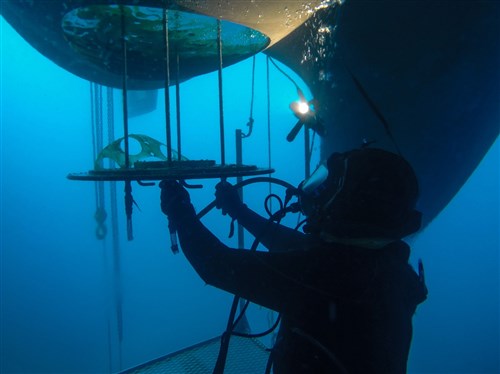 SOUDA BAY, Greece - A diver assigned to Mid Atlantic Regional Maintenance Center Norfolk, performs repairs on USS Carney (DDG 64) Jan. 13, 2016.  Carney, an Arleigh Burke-class guided-missile destroyer, forward deployed to Rota, Spain, is conducting a routine patrol in the U. S. 6th Fleet area of operations in support of U.S. national security interests in Europe. (U.S. Navy photo by Mass Communication Specialist 1st Class Theron J. Godbold/Released)