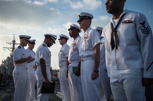 Executive department personnel aboard USS Donald Cook (DDG 75) conduct a uniform inspection March 16, 2015, in preparation for the upcoming summer uniform shift. Donald Cook, an Arleigh Burke-class guided-missile destroyer forward-deployed to Rota, Spain, is conducting naval operations in the U.S. 6th Fleet area of operations in support of U.S. national security interests in Europe. (U.S. Navy photo by Mass Communication Specialist 2nd Class Karolina A. Oseguera/Released)