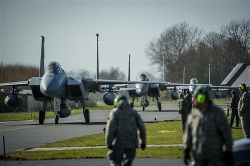F-15C Eagles taxi into position at Leeuwarden Air Base, Netherlands, March 31, 2015. F-15C Eagles from the Florida Air National Guard's 159th Expeditionary Fighter Squadron are deployed to Europe as the first ever ANG theater security package here. These F-15s will conduct training alongside our NATO allies to strengthen interoperability and to demonstrate U.S. commitment to the security and stability of Europe. (U.S. Air Force photo/ Staff Sgt. Ryan Crane)