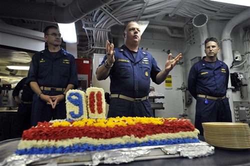 MEDITERRANEAN SEA  – Cmdr. David Bretz, commanding officer of the guided-missile destroyer USS
Jason Dunham (DDG 109), left, Cmdr. Michael Meredith, executive officer of Jason Dunham, right, and Master Chief Ray Chamberlain, Jason Dunham’s
command master chief, center, share their memories of the Sept. 11 attacks with the crew of Jason Dunham during a commemoration ceremony. Jason Dunham is on a scheduled deployment in support of maritime security operations and
theater security cooperation efforts in the U.S. 6th Fleet area of
responsibility.