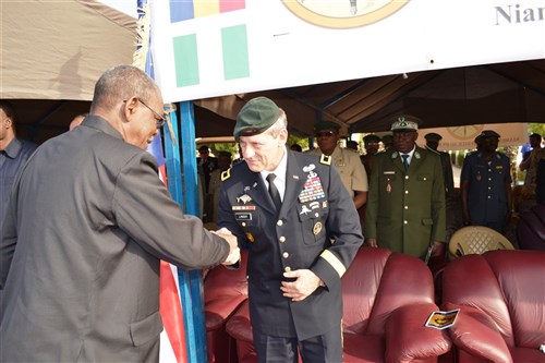 16.	Niger’s Minister of Defense M. Karidio Mahamadou shakes hands with Special Operations Command Africa Commanding General Brig. Gen. James Linder at the start of the opening ceremony of Flintlock 2014 in Niamey, Niger.  (Photos by Sgt. 1st Class Jessica Inigo)