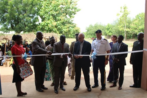 Ambassador Robert E. Whitehead marks the opening of a primary school during a ribbon cutting ceremony in Atomé, Togo, May 28, 2015. U.S. Africa Command funded the construction through the Humanitarian and Civic Assistance Program. Photo by Ben Simyeli, U. S. Embassy Lomé.